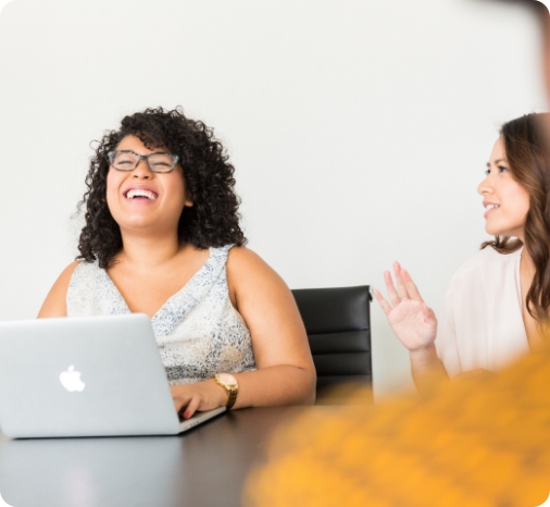 office workers smiling and laughing